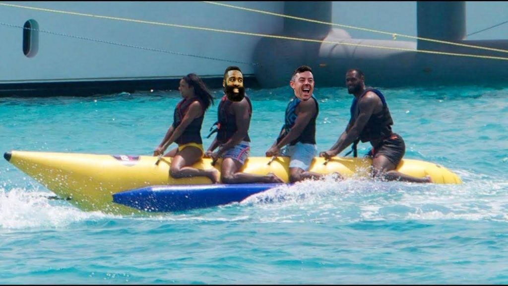Edited image of celebrities riding a banana boat on clear blue water.